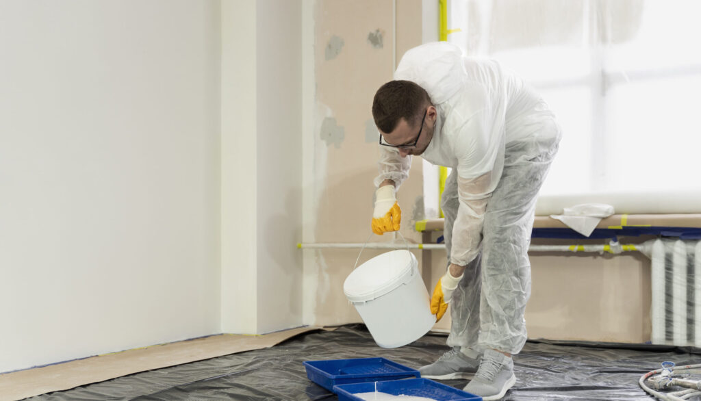 full shot man pouring paint